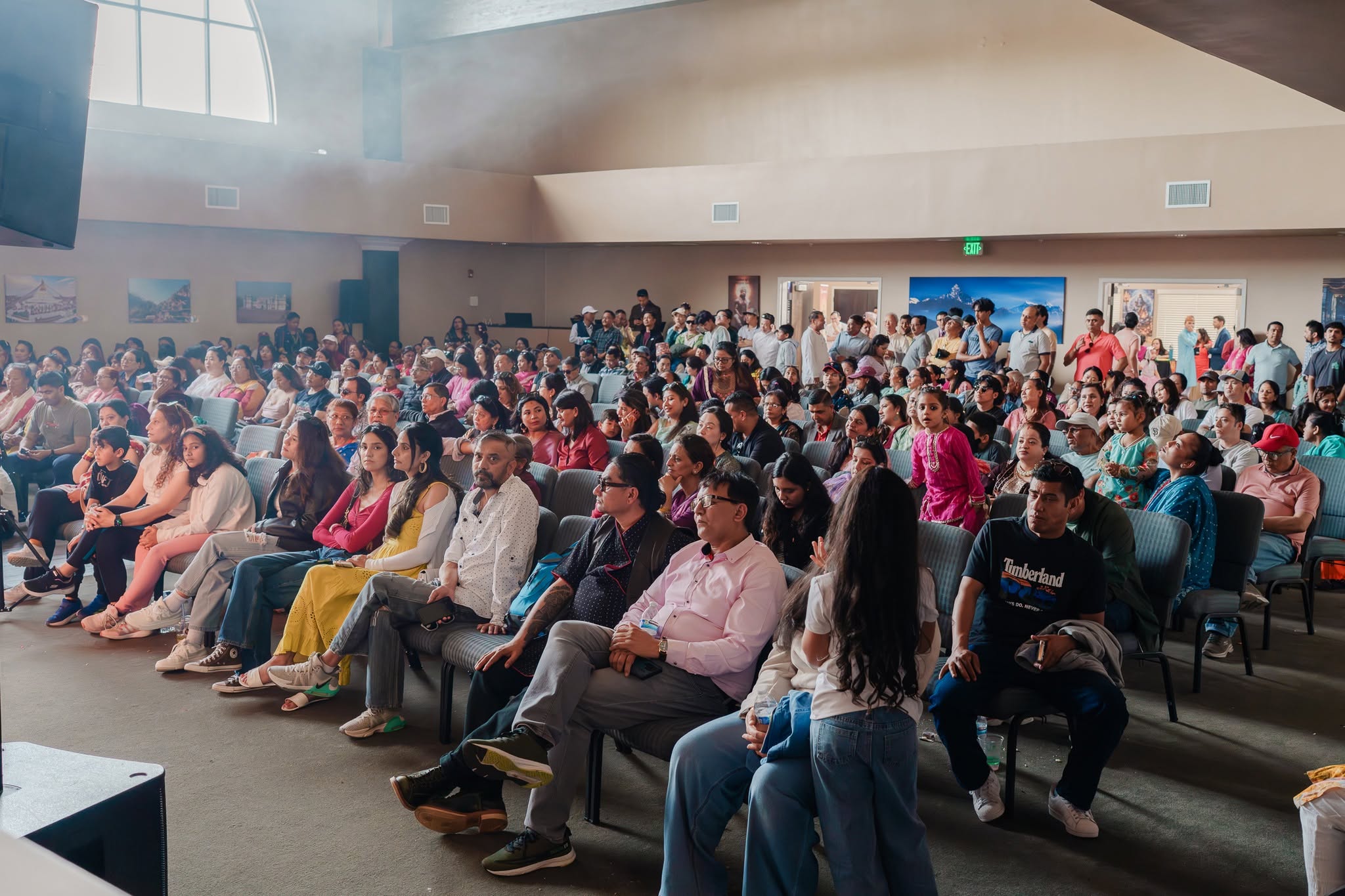A packed hall of families gathered for the Mela